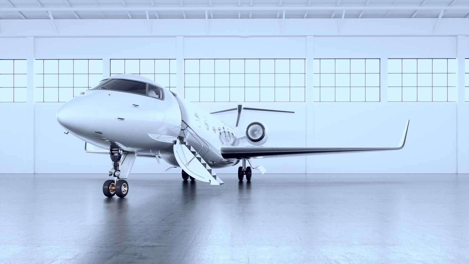 Super midsize jet in a bright hangar